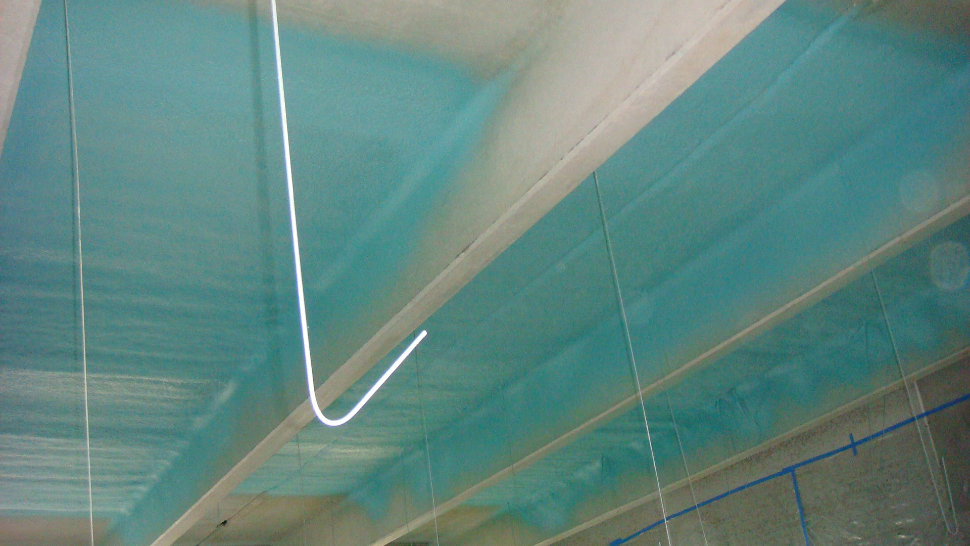 Contract coating of fabricated steel in a shop environment
